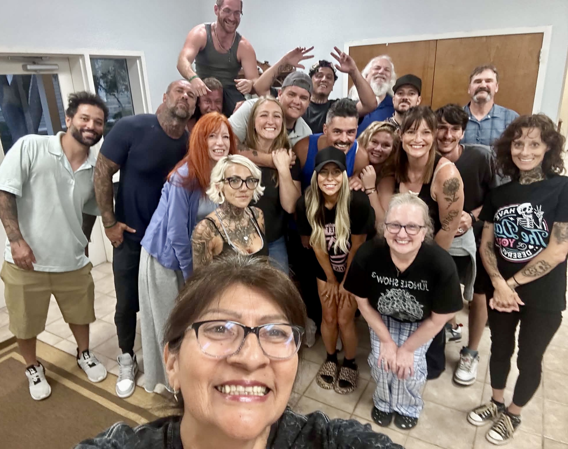 A big group selfie of the HIS House community, everyone smiling