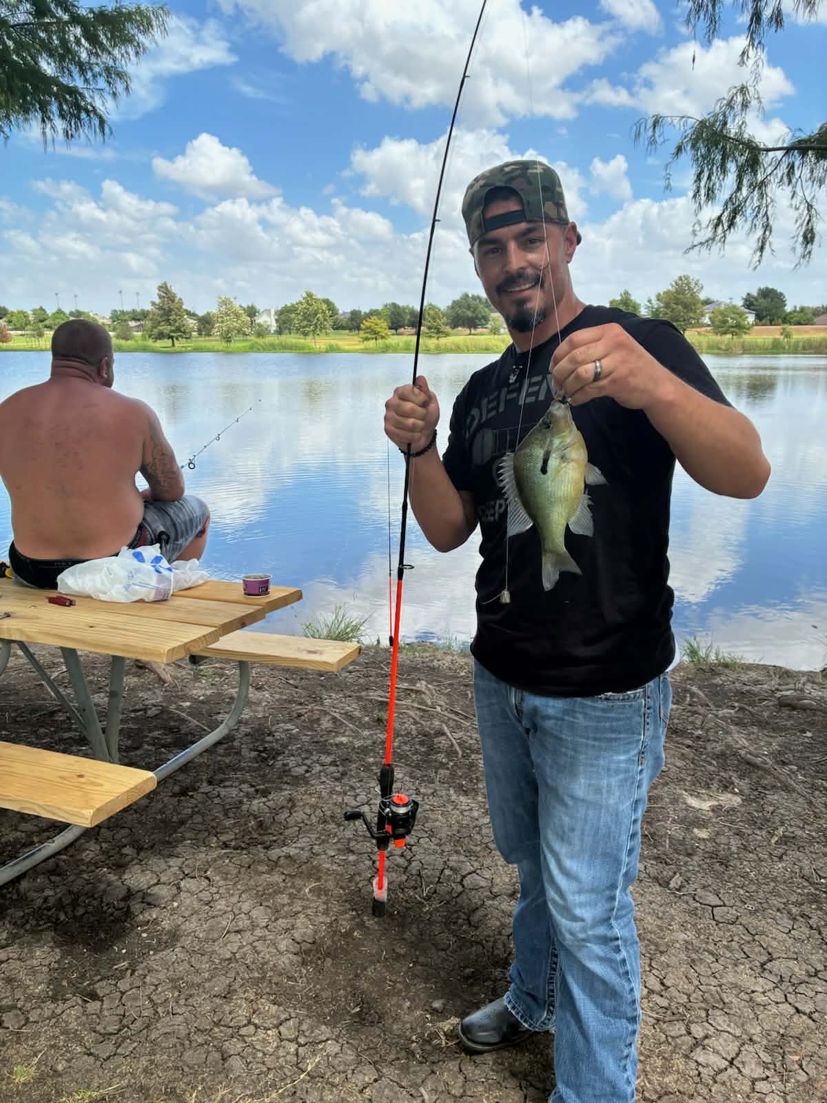 A resident proudly showing off his catch on a fishing morning