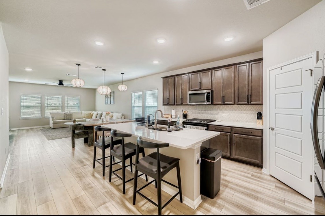 The kitchen island at HIS House with bar seating for the whole house